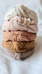 Ribbed knot headbands in natural, peach, nude, camel, cacao, and beige colors. Soft, stretchy, and comfortable for kids.