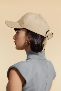 Fashionable cap with back tying