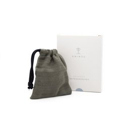 Muslin/cotton soap bag in a neutral gray color, designed to hold solid soap or shampoo bars. Made in Germany.