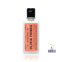  Coral orange conditioner bottle, clear glass with black cap, minimalist design, Olivia Thinks branding