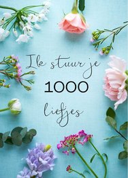 Postcard with floral design and text "I send you 1000 sweethearts"