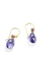 Gold earrings with teardrop-shaped tanzanite crystal drops. Elegant and sophisticated design.