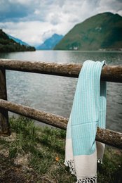 This beach towel is a versatile and stylish accessory for any outdoor adventure. Made of high-quality materials, it features a beautiful hand-knotted design in a variety of soothing colors including black, light grey, turquoise, indigo, sea blue, beige, cherry, dark pink, pale rose, bordeaux, dark lilac, baby blue, coral, apricot, sund, mustard, and lime green. The towel is perfect for use on the beach, by the pool, or as a cozy wrap on a cool evening. Its durable construction and soft, absorbent fabric make it a practical and fashionable choice for all your summer activities.