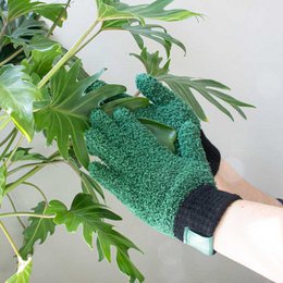 Green microfiber dusting gloves for cleaning and caring for plants. Made of soft, durable material that helps remove dust and debris from leaves without damaging delicate foliage.