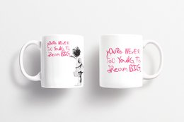 White ceramic mug with Banksy-inspired graffiti art and text "Dream big" printed on it. Suitable for coffee, tea, or other hot beverages.