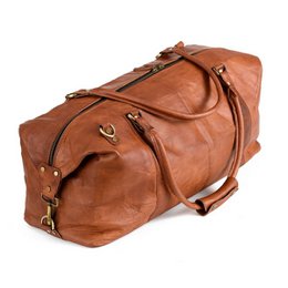  Tan leather weekend bag with multiple compartments and straps for easy carrying.