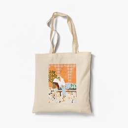 Organic tote bag with a colorful, whimsical design featuring a fox and floral elements. Made of durable, natural cotton canvas.