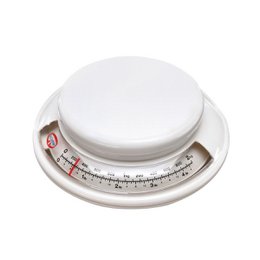 A white kitchen scale with a round dial and a maximum capacity of 2 kg. The scale is part of the Dr. Oetker Baker Edition line of baking products.