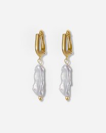 Elegant pearl drop earrings with a gold-tone finish, perfect for adding a touch of sophistication to any outfit.