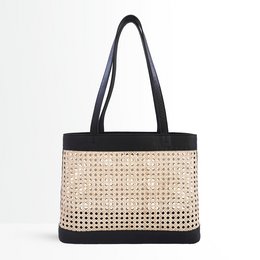 A beige and black shoulder bag with a woven pattern and leather trim. The bag has a rectangular shape and two handles for carrying.