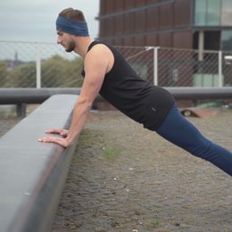 Black men's merino wool tank top, sleeveless, slim fit design.
