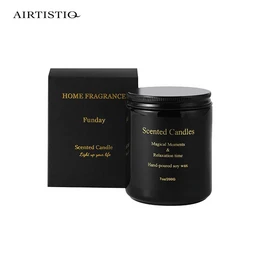 Amber-colored, handmade soy wax candle with aromatherapy scent and lid. Suitable for home decor and relaxation.