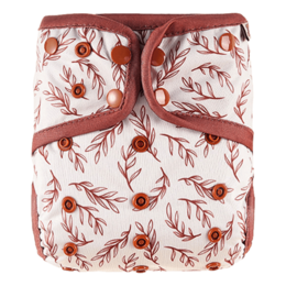 Diaper pants with a floral pattern featuring red and white leaves and flowers. The diaper has a red trim and closure.