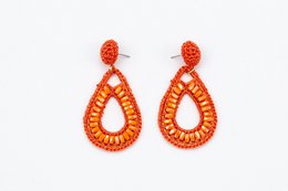  Stainless steel gold-colored statement earrings with an oval design. The earrings feature a textured, hammered finish for a unique, eye-catching look.