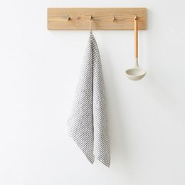 Thin black stripes linen kitchen towel with a simple, modern design. Made of high-quality linen material, suitable for drying dishes or hands in the kitchen.