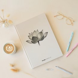 Undated weekly planner with a lotus flower design, suitable for general use.