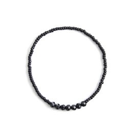  Black beaded bracelet with round beads.