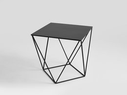 A modern, minimalist side table with a square black top and a geometric metal frame in black, gold, or white.