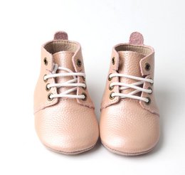 Soft soled pink leather ankle boots for babies, available in sizes 17-22.