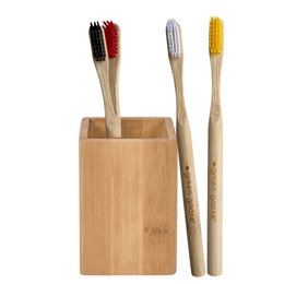 Bamboo toothbrush holder with 4 Castor toothbrushes in various colors. Wooden, eco-friendly design.