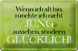 Vintage tin sign with German text, featuring a green background with floral patterns. The text reads "If I'm old, I don't want to look young, but happy!"