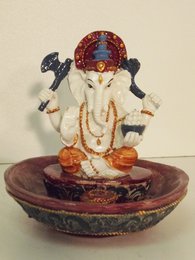  Multicolored Ganesh incense holder made of ceramic material, featuring the Hindu deity Ganesh in a seated position with intricate decorative patterns.