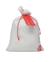 A white fabric bag containing a honeysuckle-scented bath soak product from the Barr-Co Soap Shop.