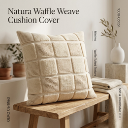  Beige cushion cover with a block pattern and textured surface, suitable for a variety of home decor styles.