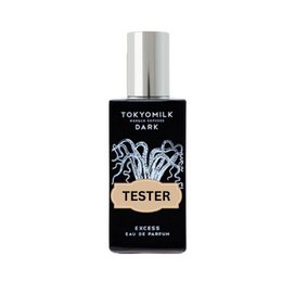 Black glass bottle with white floral design, labeled "Tokyomilk Dark Excess Parfum TESTER". Floral, dark, and mysterious fragrance.