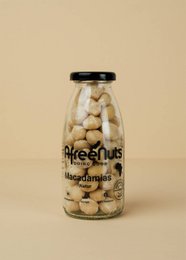 Premium organic macadamia nuts in a glass bottle, natural and unsalted, 150g content.