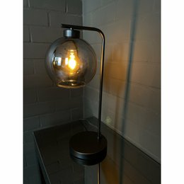 Black table lamp with glass globe shade