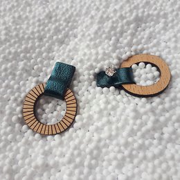 Petrol blue stud earrings with wooden and fabric accents.