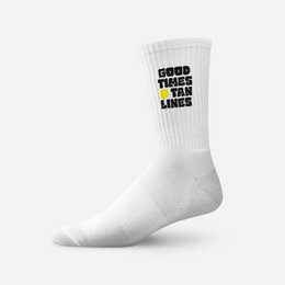  White crew socks with "Good Times Tan Lines" text, retro style, casual athletic wear.