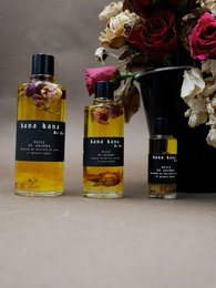 Jojoba oil, rosebuds, and rose quartz body oil in 50ml, 100ml, and 15ml sizes. Warm, floral scent with natural ingredients.