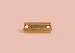 Ash wood storage basket with metal accents. Rectangular shape, natural wood finish.