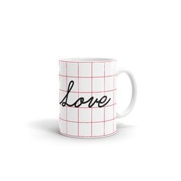 A white ceramic mug with the word "love" written in cursive script on a grid pattern background. The mug is a simple, minimalist design that would be suitable for everyday use or as a gift.