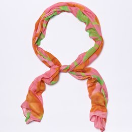 Vibrant tulip-patterned scarf in shades of pink, orange, and green.