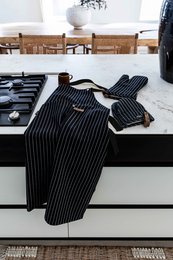 Black and white striped oven glove with Sherlock branding, designed for heat protection while cooking.