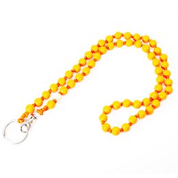 Vibrant yellow keychain with round, bead-like charms. Ideal for adding a pop of color and style to any bag or accessory.