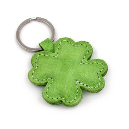 Green clover-shaped leather keychain with shamrock design.