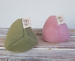 Eco-friendly dog toys made from organic cotton, available in small and large sizes. Soft, plush shapes in green and pink colors.