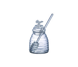 Small glass jar with honey and wooden spoon. Transparent glass container with golden honey liquid and wooden honey dipper.