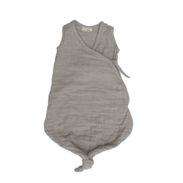 Beige sleeping bag for infants aged 6-12 months. Made of soft, breathable material to keep baby comfortable and cozy during sleep.