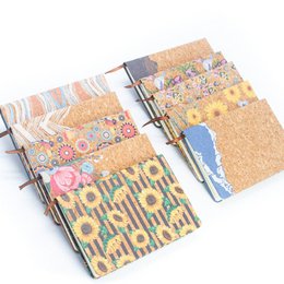 Natural cork printed notebook with colorful floral and abstract patterns. Made of sustainable cork material with a soft, textured cover. Ideal for writing, journaling, or sketching.