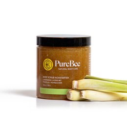 A lemongrass body scrub in a glass jar, featuring natural ingredients like lemongrass and shea butter to exfoliate and nourish the skin.