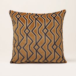 "Cushion cover with a geometric pattern in shades of yellow, brown, and black. The cover has a square shape and is made of a soft, textured fabric."

The cushion cover features a bold geometric pattern in shades of yellow, brown, and black. The pattern consists of zig-zag and diamond shapes, creating a visually striking design. The cushion cover has a square shape and is made of a soft, textured fabric that would provide comfort and style to any living space.