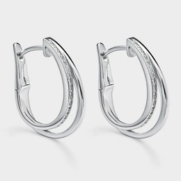  Silver hoop earrings with white zircon stones, a statement jewelry piece for any occasion.
