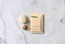 Philo Multi - REFILL, a supplement product. Tan-colored packaging, contains powder or granules. Suitable for dietary supplements or health-related products.