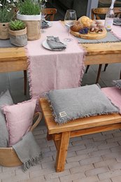 A 40x250 cm handmade table runner in grey, pink, or denim-grey colors, made of high-quality materials for a stylish and functional addition to any dining table.