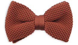 A rust brown knitted bow tie with a textured pattern, suitable for formal or casual wear.
